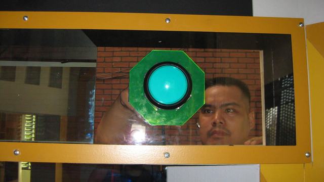 Paul installing a button for a game show.