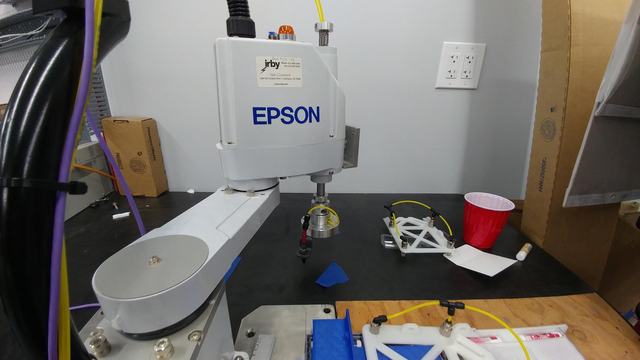 An Epson robotic arm being programmed and tested.